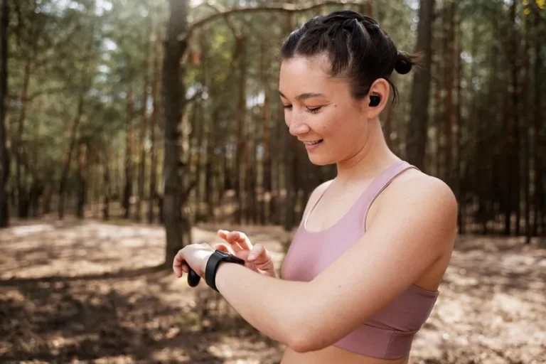 side-view-smiley-woman-checking-her-watch_
